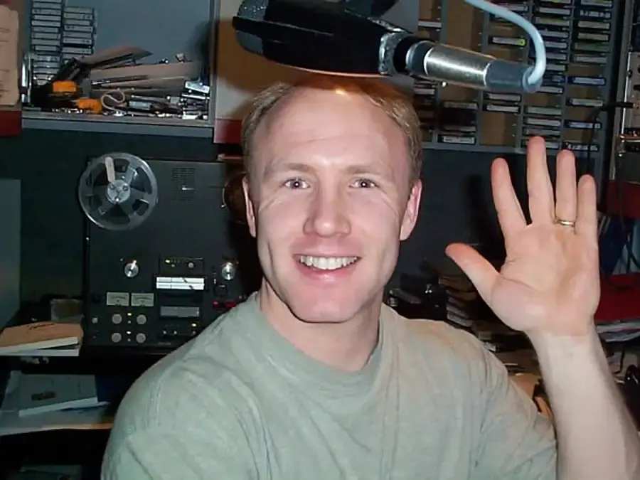 Rich Conway producing a radio commercial in the Connecticut Website Company studio